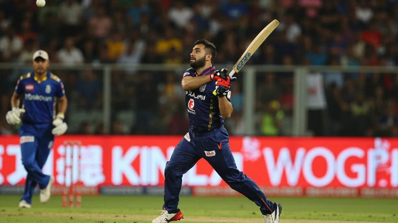 Tight sideline view of an IPL player in mid-action during a floodlit match